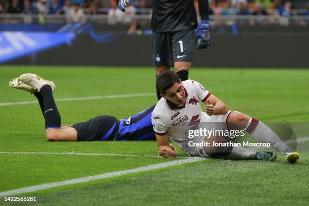 Emirhan Ilkhan of Torino FC cuts his head following a clash of heads with Stefan de Vrij of FC Internazionale during the Serie A match between FC...