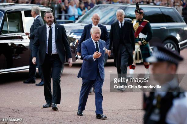 King Charles III steps from his motorcade during an impromptu walkabout on the Mall outside of St. James Palace following the death of his mother...
