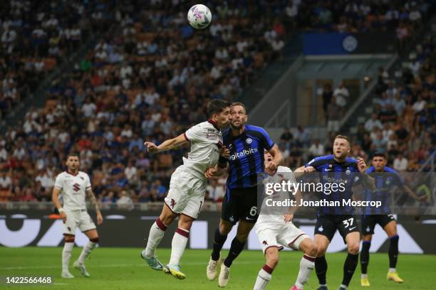 Emirhan Ilkhan of Torino FC clashes heads with Stefan de Vrij of FC Internazionale during the Serie A match between FC Internazionale and Torino FC...