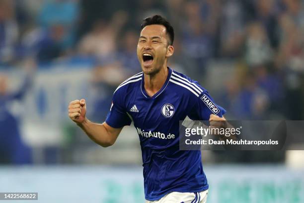 Maya Yoshida of FC Schalke 04 celebrates after Erhan Masovic of VfL Bochum scores their sides own goal during the Bundesliga match between FC Schalke...