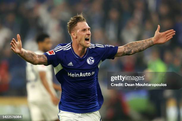 Sebastian Polter of FC Schalke 04 celebrates after scoring their sides third goal during the Bundesliga match between FC Schalke 04 and VfL Bochum...
