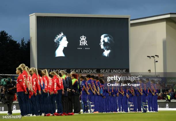 Players and spectators observe a minute silence, as an LED board inside the stadium pays tribute to Her Majesty Queen Elizabeth II, who died away at...