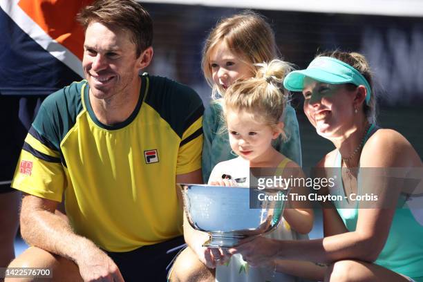 September 10: Storm Sanders and John Peers of Australia, with his children, with the winners trophy after their victory against Kirsten Flipkins of...