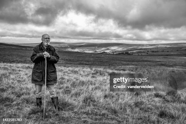 farmer on the moors - waxed jacket stock pictures, royalty-free photos & images