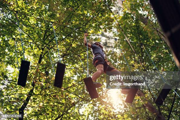 V Walk High Ripes 75 High Ropes Kid Stock Photos, High-Res Pictures, and Images - Getty ...