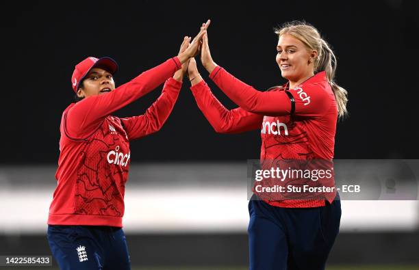 England bowler Sarah Glenn celebrates the wicket of India batter Shafali Verma with Sophia Dunkley during the 1st Vitality IT20 match between England...