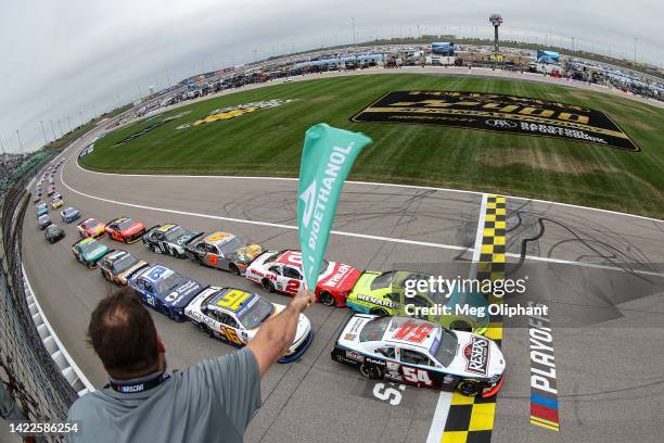 Brandon Jones, driver of the Menards/Klearvue Cabinetry Toyota, leads the field the field to the green flag to start the NASCAR Xfinity Series Kansas...