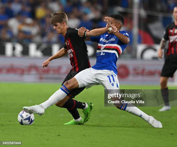 Charles De Ketelaere of AC Milan competes for the ball with Abdelhamid Sabiri of UC Sampdoria during the Serie A match between UC Sampdoria and AC...
