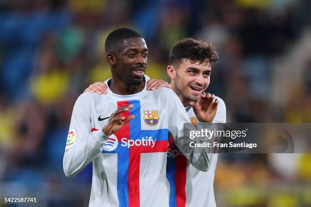 Ousmane Dembele of FC Barcelona celebrates with teammate Pedri of FC Barcelona after scoring their side's fourth goal during the LaLiga Santander...