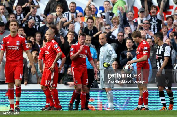 Referee Martin Atkinson shows a red card to Pepe Reina of Liverpool during the Barclays Premier League match between Newcastle United and Liverpool...