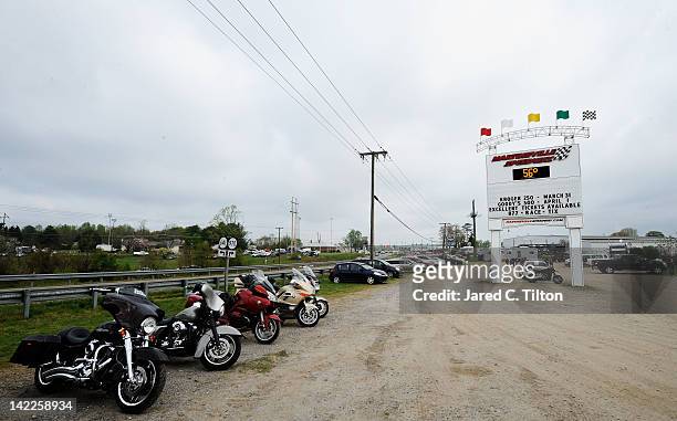 Motorcycles are parked near the entrance sign for Martinsville Speedway prior to the NASCAR Sprint Cup Series Goody's Fast Relief 500 at on April 1,...
