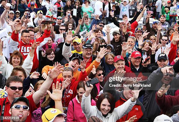 Fans cheer during a Miss Sprint appearance prior to the NASCAR Sprint Cup Series Goody's Fast Relief 500 at Martinsville Speedway on April 1, 2012 in...