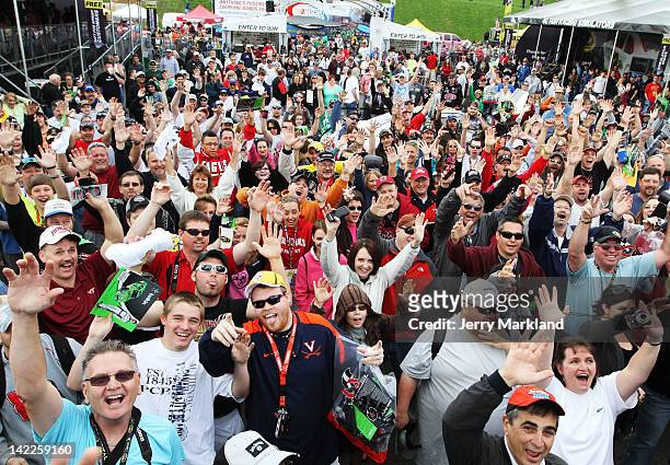 Fans cheer during a Miss Sprint appearance prior to the NASCAR Sprint Cup Series Goody's Fast Relief 500 at Martinsville Speedway on April 1, 2012 in...