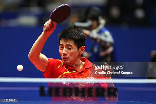 Zhang Jike of China plays a forehand during his match against Timo Boll of Germany during the LIEBHERR table tennis team world cup 2012 championship...
