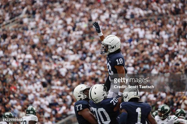 Omari Evans of the Penn State Nittany Lions celebrates with teammates after scoring a touchdown against the Ohio Bobcats during the second half at...