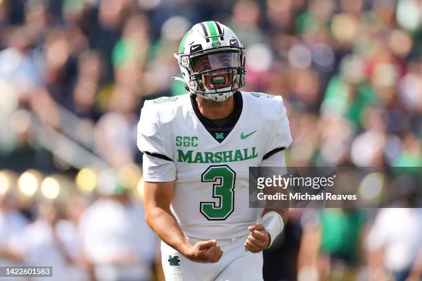 Henry Colombi of the Marshall Thundering Herd celebrates a touchdown by Khalan Laborn against the Notre Dame Fighting Irish during the first half at...