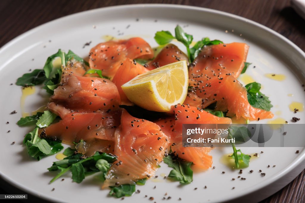 Salmon carpaccio dish