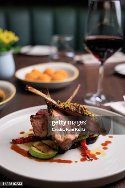 grilled lamb rib chops with side dish and wine - fillet stock pictures, royalty-free photos & images