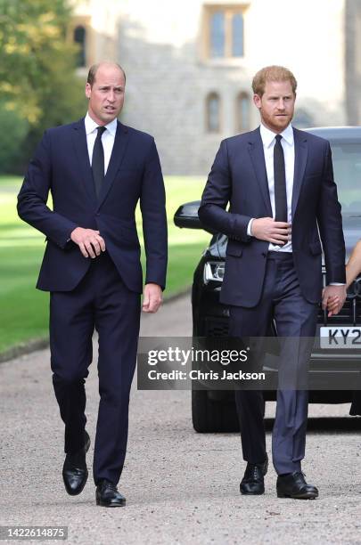 Prince William, Prince of Wales and Prince Harry, Duke of Sussex on the long Walk at Windsor Castle on September 10, 2022 in Windsor, England. Crowds...