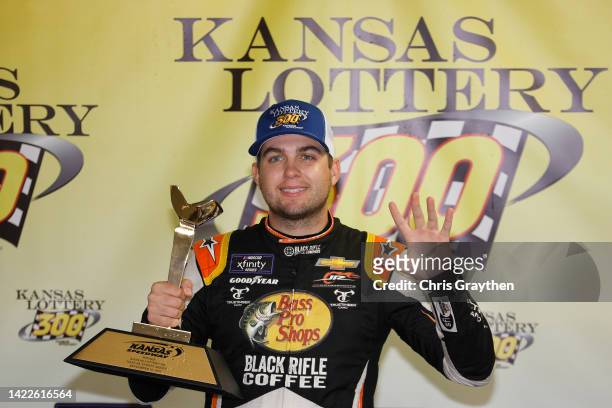 Noah Gragson, driver of the Bass Pro Shops/TrueTimber/BRCC Chevrolet, celebrates in victory lane after winning the NASCAR Xfinity Series Kansas...