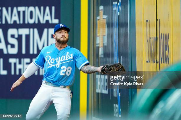 Kyle Isbel of the Kansas City Royals catches a Detroit Tigers foul ball on the warning track during the third inning at Kauffman Stadium on September...