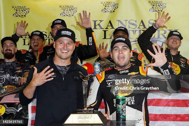 Noah Gragson, driver of the Bass Pro Shops/TrueTimber/BRCC Chevrolet, and crew chief Lucas Lambert celebrate in victory lane after winning the NASCAR...