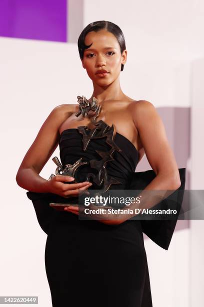 Taylor Russell poses with the Marcello Mastroianni Award for Best New Young Actress for "Bones And All" during the award winners photocall at the...