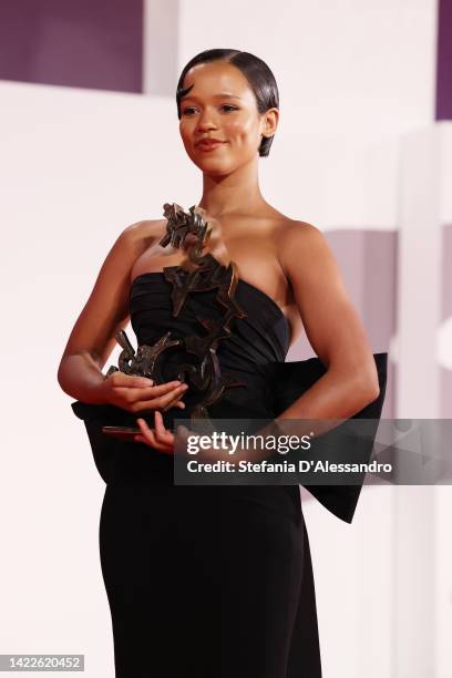 Taylor Russell poses with the Marcello Mastroianni Award for Best New Young Actress for "Bones And All" during the award winners photocall at the...