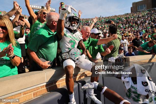 Steven Gilmore of the Marshall Thundering Herd celebrates an interception that he returned for a touchdown against the Notre Dame Fighting Irish...