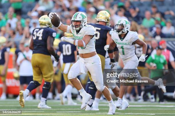 Owen Porter of the Marshall Thundering Herd celebrates an interception against the Notre Dame Fighting Irish during the second half at Notre Dame...