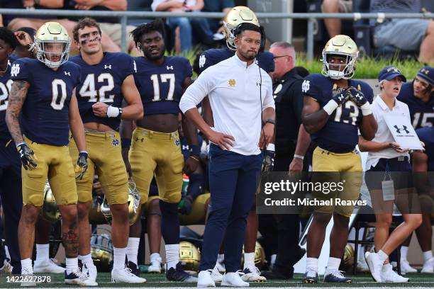 Head coach Marcus Freeman of the Notre Dame Fighting Irish looks on from the sideline against the Marshall Thundering Herd during the second half at...