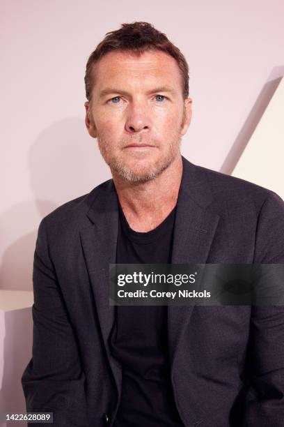 Sam Worthington poses at the IMDb Official Portrait Studio during D23 2022 at Anaheim Convention Center on September 10, 2022 in Anaheim, California.