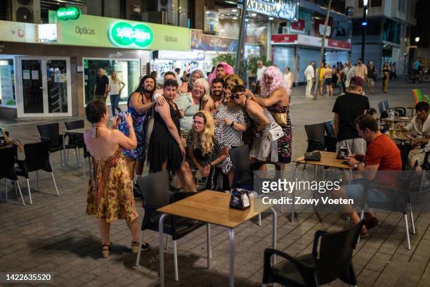 Tourists celebrate a bachelor party in the old town on the night of the crowning of the new King Charles III on September 10, 2022 in Benidorm,...