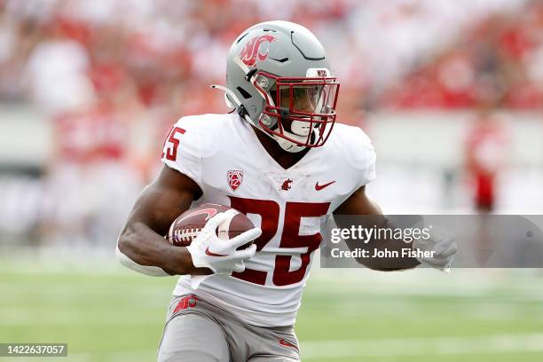 Nakia Watson of the Washington State Cougars rushes the ball in the third quarter against the Wisconsin Badgers at Camp Randall Stadium on September...