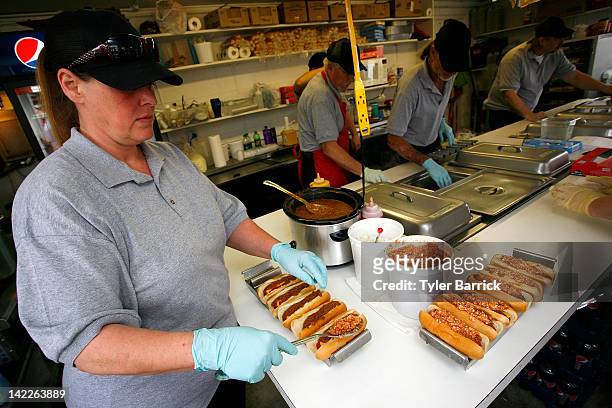 Martinsville Slider hot dogs are prepared in a concession stand prior to the start of the NASCAR Sprint Cup Series Goody's Fast Relief 500 at...