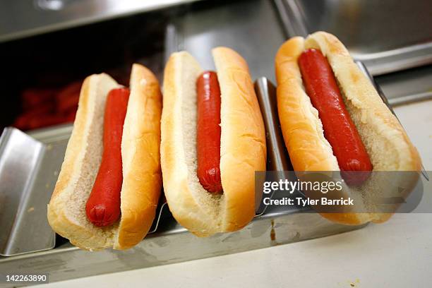 Martinsville Slider hot dogs are prepared in a concession stand prior to the start of the NASCAR Sprint Cup Series Goody's Fast Relief 500 at...