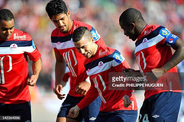 Lille's Belgian midfielder Eden Hazard celebrates with teammates after scoring a goal during the French L1 football match Lille vs Toulouse on April...