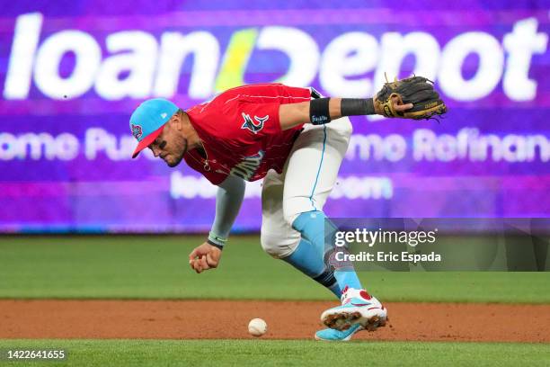 Miguel Rojas of the Miami Marlins misplays a ground ball during the first inning against the New York Mets at loanDepot park on September 10, 2022 in...