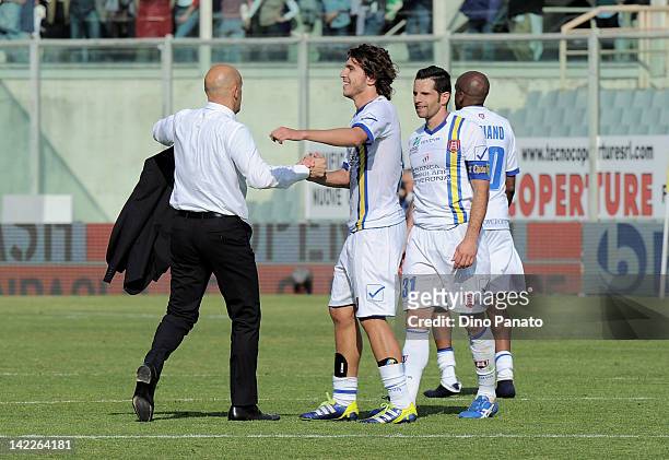 Chievo head coach Domenico Di Carlo celebrates victory with his players Alberto Paloschi and Sergio Pellissier after the Serie A match between ACF...