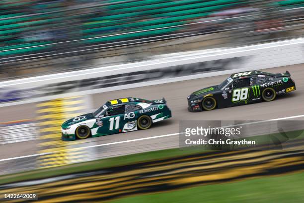 Daniel Hemric, driver of the AG1 - Athletic Greens Chevrolet, and Riley Herbst, driver of the Monster Energy Ford, race during the NASCAR Xfinity...
