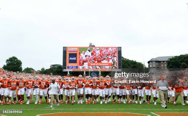 The Clemson Tigers walk on the field before their game against the Furman Paladins at Memorial Stadium on September 10, 2022 in Clemson, South...