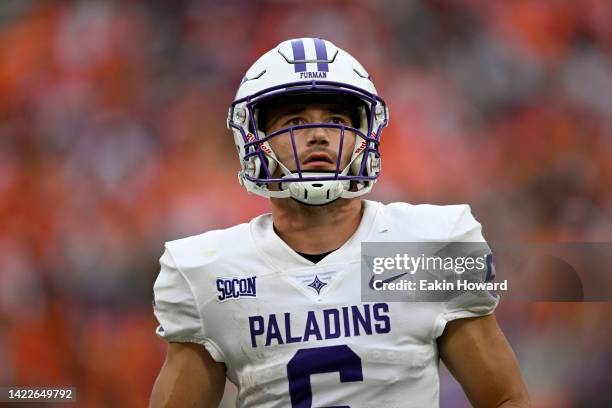 Tyler Huff of the Furman Paladins walks off the field after missing a third down pass against the Clemson Tigers in the fourth quarter at Memorial...