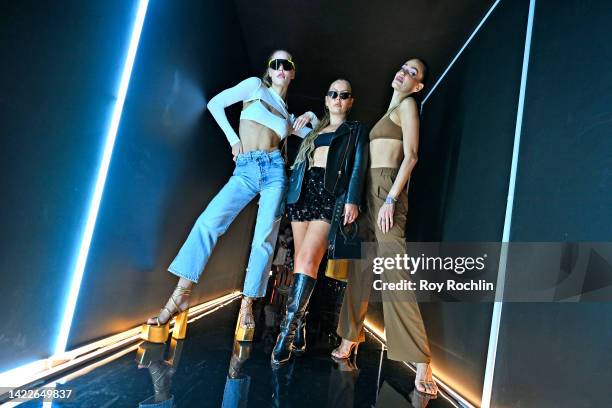 Joy Corrigan, Serena Kerrigan and guest pose at the alo presentation during NYFW: The Shows 2022 at Spring Studios on September 10, 2022 in New York...