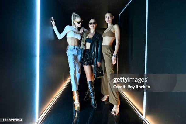 Joy Corrigan, Serena Kerrigan and guest pose at the alo presentation during NYFW: The Shows 2022 at Spring Studios on September 10, 2022 in New York...