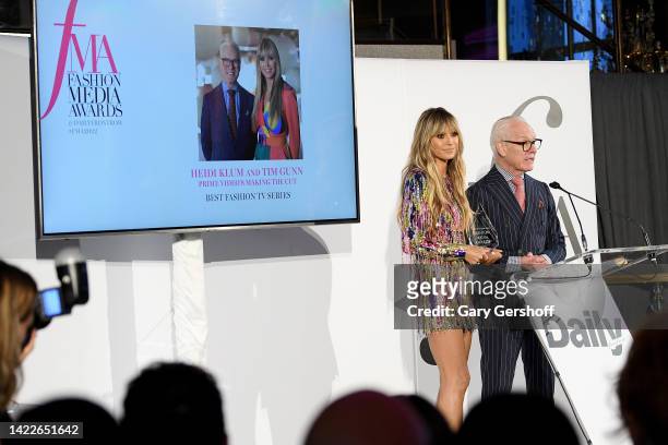 Heidi Klum and Tim Gunn accept an award on stage during the Daily Front Row Fashion Media Awards at The Rainbow Room on September 10, 2022 in New...