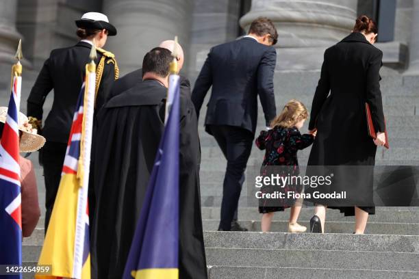 New Zealand Prime Minister Jacinda Ardern her daughter Neve Te Aroha Ardern Gayford and Clarke Gayford walk back up the steps of parliament after the...