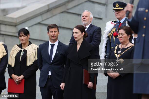 New Zealand Prime Minister Jacinda Ardern and her fiance Clarke Gayford listen on during the proclamation of accession ceremony to acknowledge King...