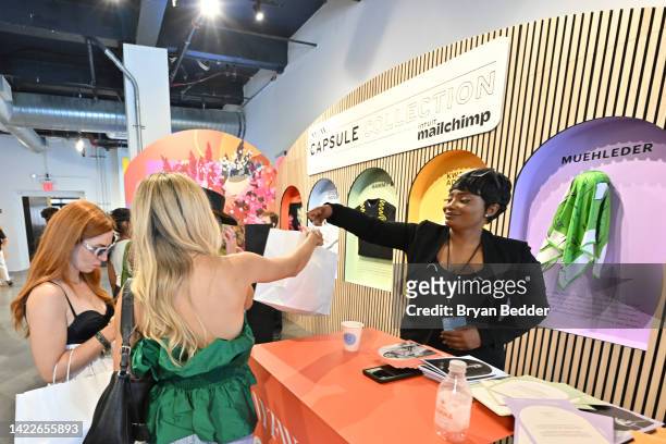 Guests make a purchase at the NYFW Capsule Collection Presented by Intuit Mailchimp during NYFW: The Shows 2022 at Spring Studios on September 10,...