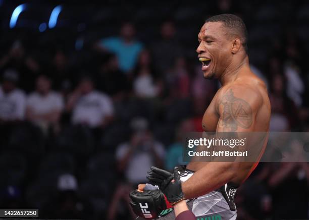 Jailton Almeida of Brazil celebrates after his submission victory over Anton Turkalj of Sweden in a 220-pound catchweight fight during the UFC 279...