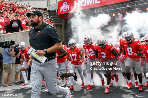 Coach Ryan Day of the Ohio State Buckeyes takes the field with the team before playing the Arkansas State Red Wolves at Ohio Stadium on September 10,...